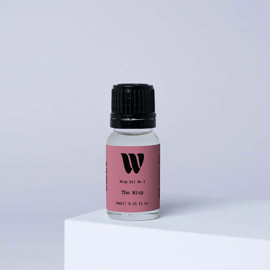 Bottle of the 10ml Wisp home fragrance oil No.1 The Wisp which has notes of amber, jasmine, coconut and bergamot.