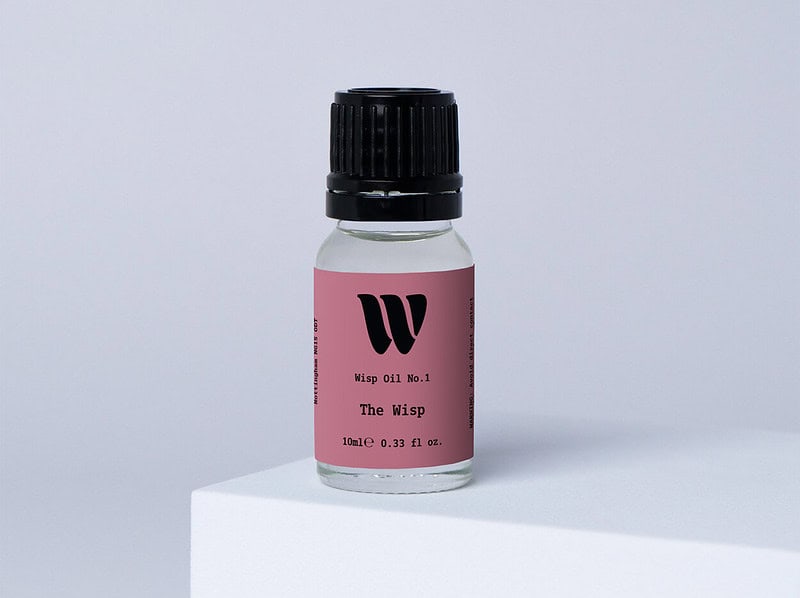 Bottle of the 10ml Wisp home fragrance oil No.1 The Wisp which has notes of amber, jasmine, coconut and bergamot.