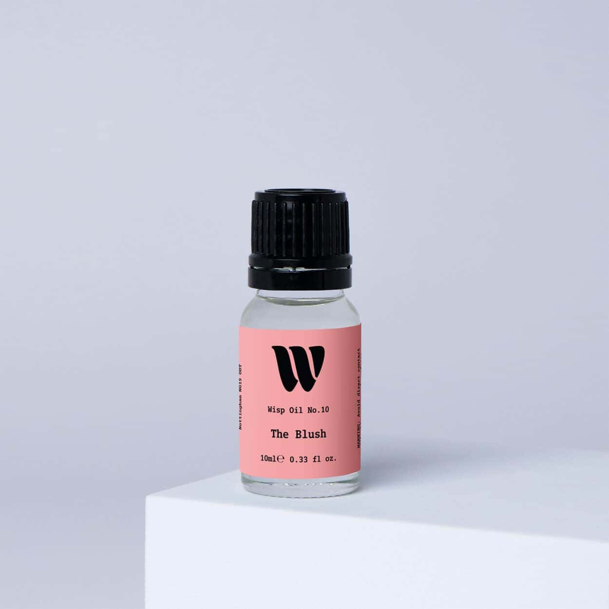 Bottle of the 10ml Wisp home fragrance oil No.10 The Blush which has notes of red apple, peony and jasmine.