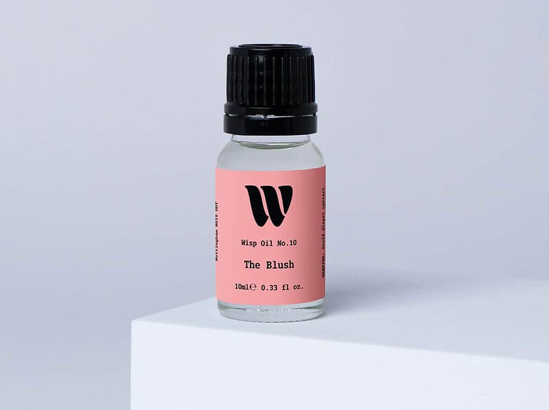 Bottle of the 10ml Wisp home fragrance oil No.10 The Blush which has notes of red apple, peony and jasmine.