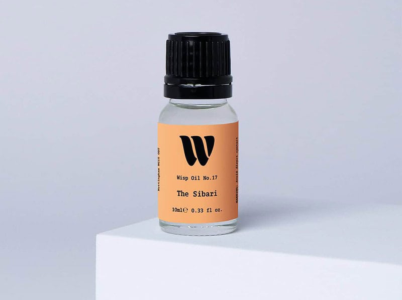 Bottle of the 10ml Wisp home fragrance oil No.17 The Sibari which has notes of orange and citrus.