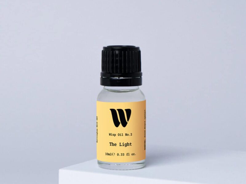Bottle of the 10ml Wisp home fragrance oil No.2 The Light which has notes of citrus, fresh grass and ocean breeze