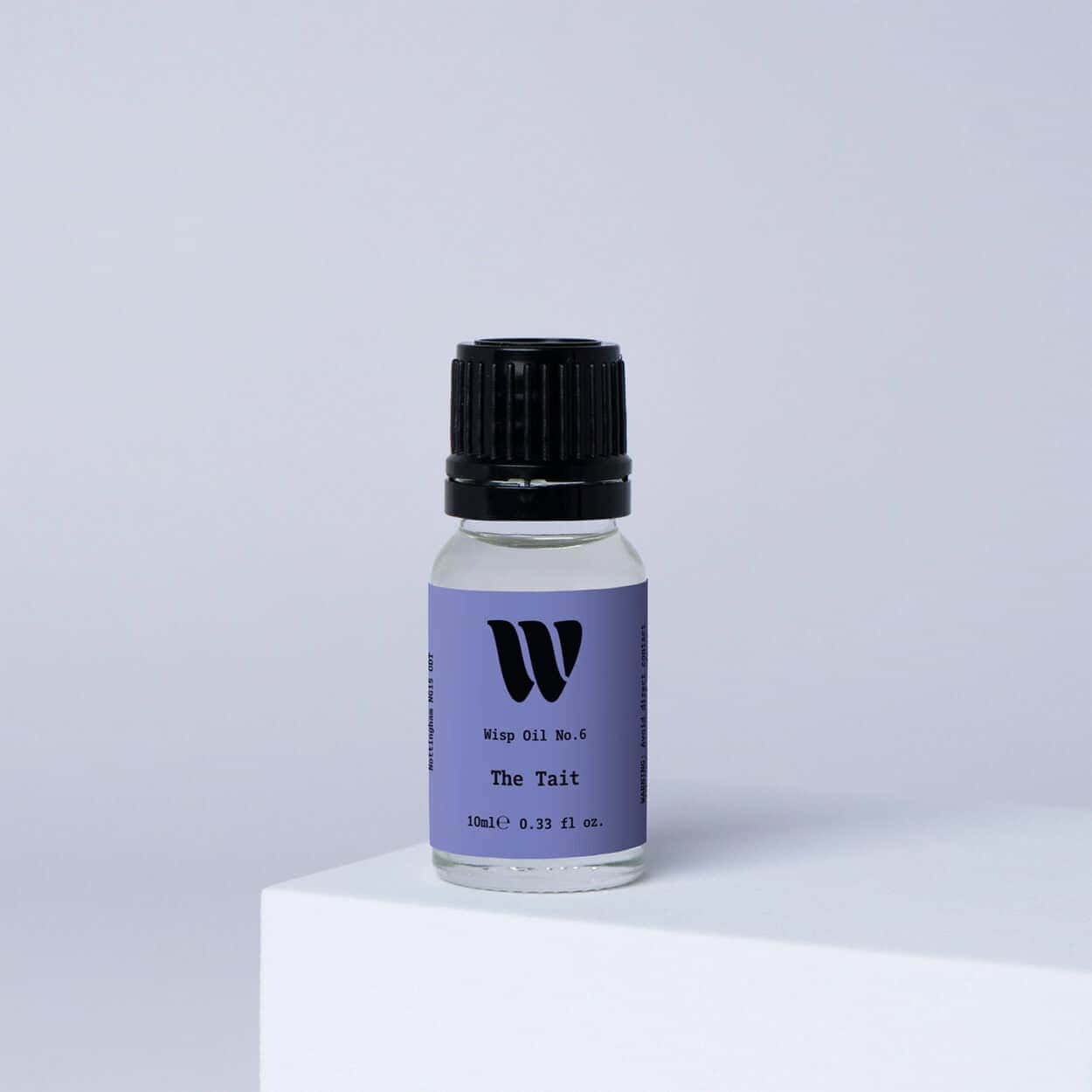 Bottle of the 10ml Wisp home fragrance oil No.6 The Tait which has notes of orange and grass.