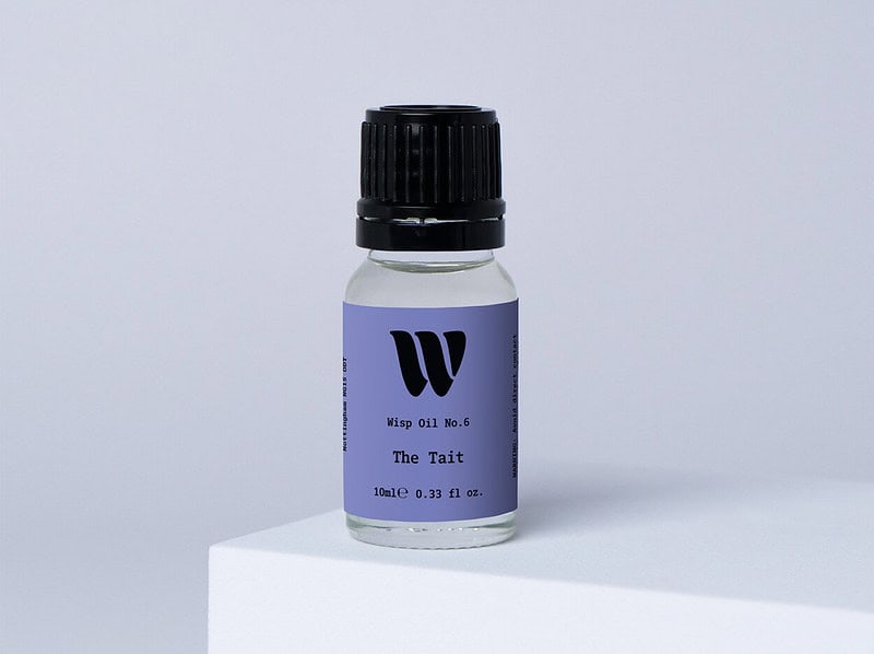 Bottle of the 10ml Wisp home fragrance oil No.6 The Tait which has notes of orange and grass.