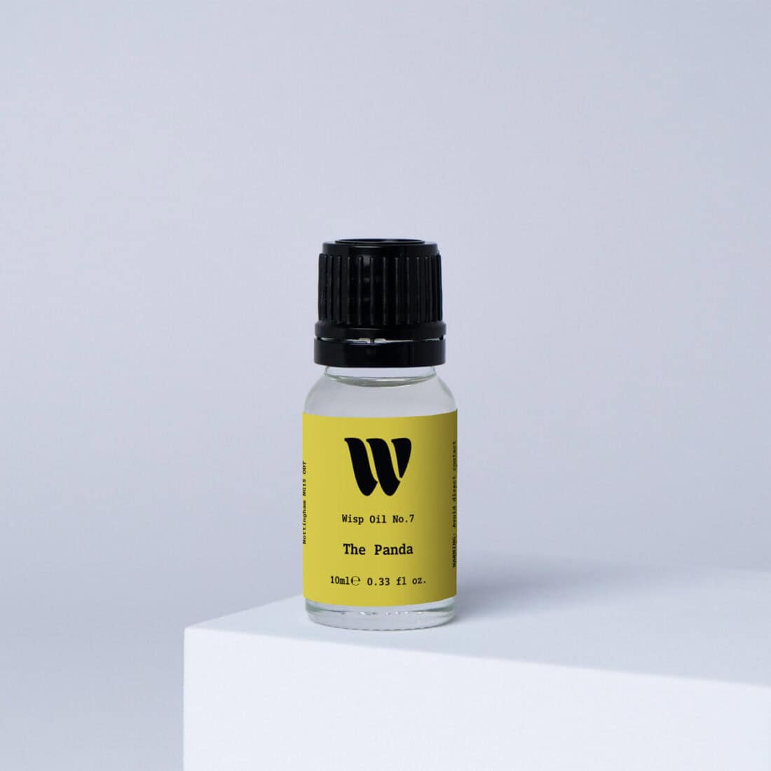 Bottle of the 10ml Wisp home fragrance oil No.7 The Panda which has notes of ylang-ylang, orange blossom, and bergamot