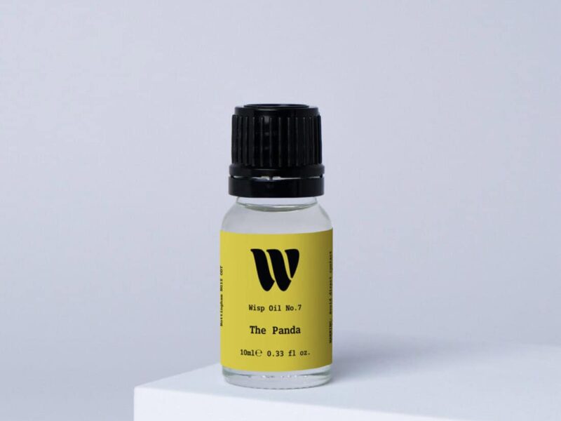 Bottle of the 10ml Wisp home fragrance oil No.7 The Panda which has notes of ylang-ylang, orange blossom, and bergamot