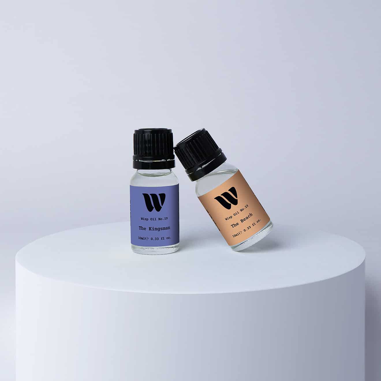 Duo bottles of the 10ml Wisp home fragrance oil No.19 The Kingsman which has notes of smoky sandalwood and vetiver, and No.23 The Beach which has notes of subtle spices. A perfect gift set for birthday and christmas.