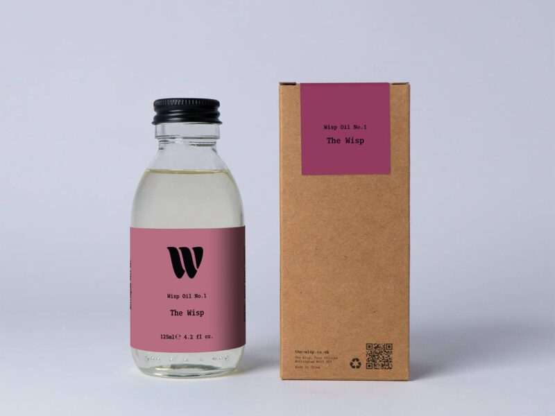 Bottle of the 125ml Wisp home fragrance oil No.1 The Wisp which has notes of amber, jasmine, coconut and bergamot.