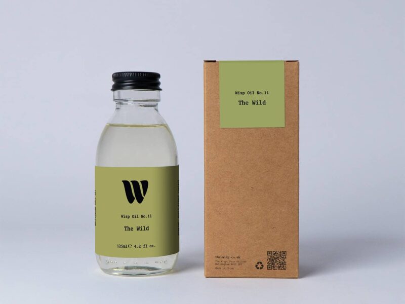Bottle of the 125ml Wisp home fragrance oil No.11 The Wild which has notes of floral lily of the valley and persimmon.