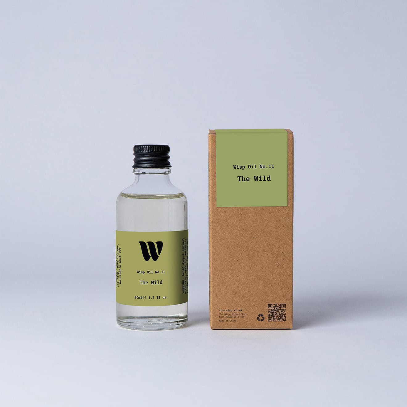 Bottle of the 50ml Wisp home fragrance oil No.11 The Wild which has notes of floral lily of the valley and persimmon.
