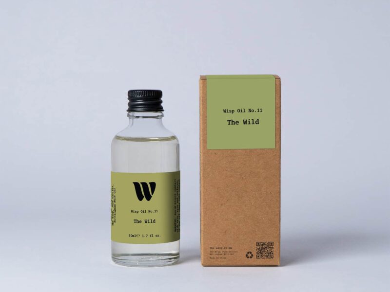 Bottle of the 50ml Wisp home fragrance oil No.11 The Wild which has notes of floral lily of the valley and persimmon.