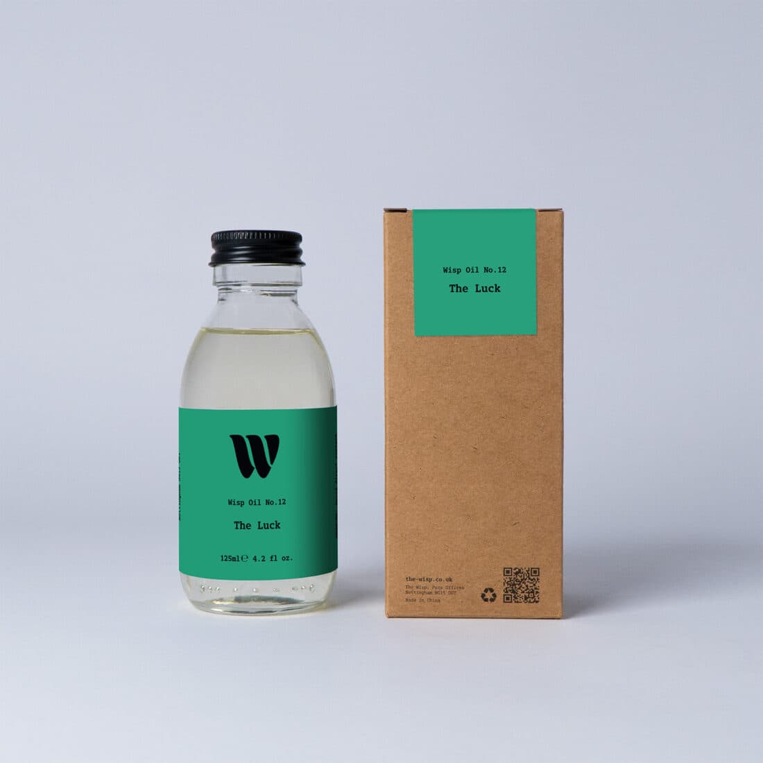 Bottle of the 125ml Wisp home fragrance oil No.12 The Luck which has notes of amber, clover and ivy.