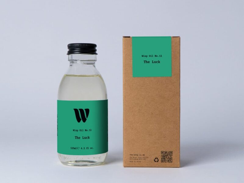Bottle of the 125ml Wisp home fragrance oil No.12 The Luck which has notes of amber, clover and ivy.