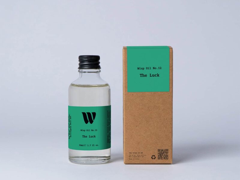 Bottle of the 50ml Wisp home fragrance oil No.12 The Luck which has notes of amber, clover and ivy.