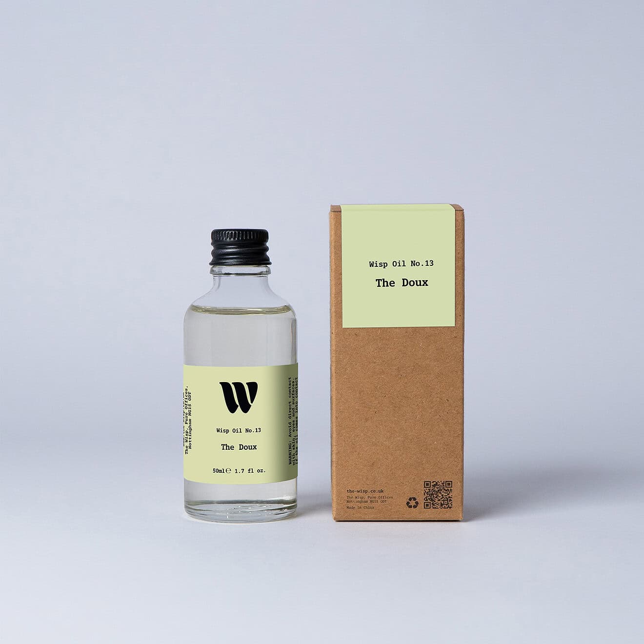 Bottle of the 50ml Wisp home fragrance oil No.13 The Doux which has notes of lush rose, carnation, and ylang-ylang.
