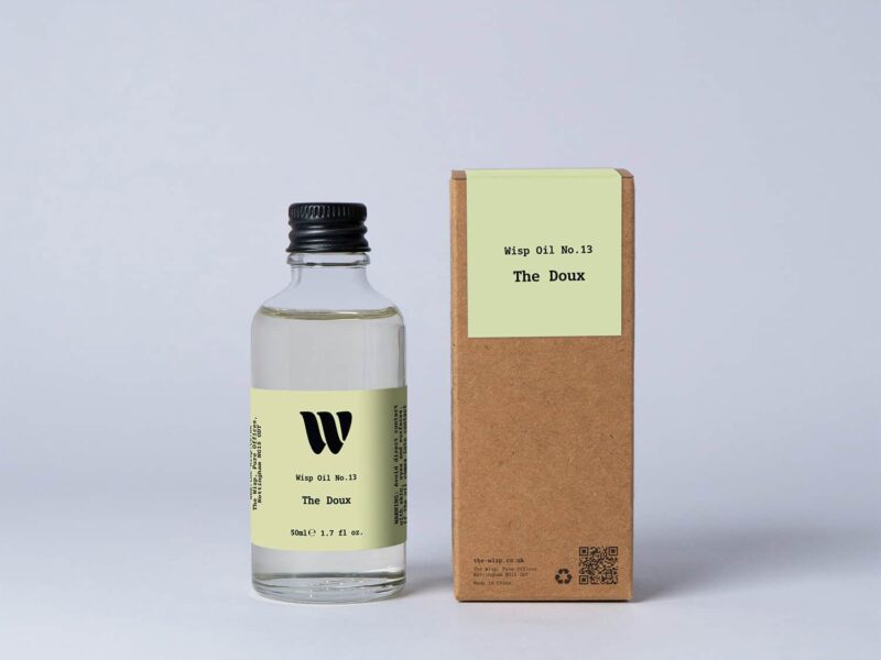 Bottle of the 50ml Wisp home fragrance oil No.13 The Doux which has notes of lush rose, carnation, and ylang-ylang.