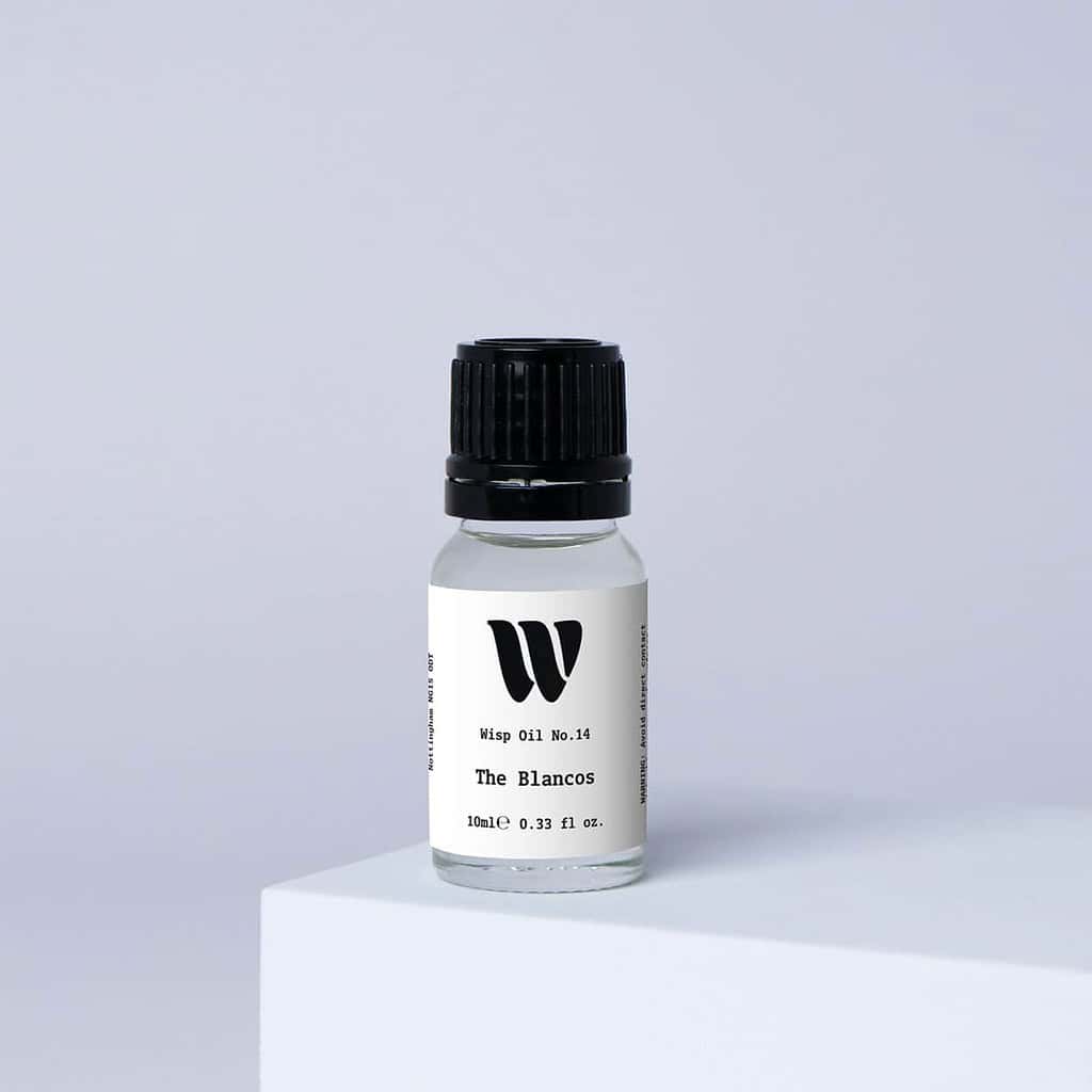 Bottle of the 10ml Wisp home fragrance oil No.14 The Blancos which has notes of soft violet and magnolia.