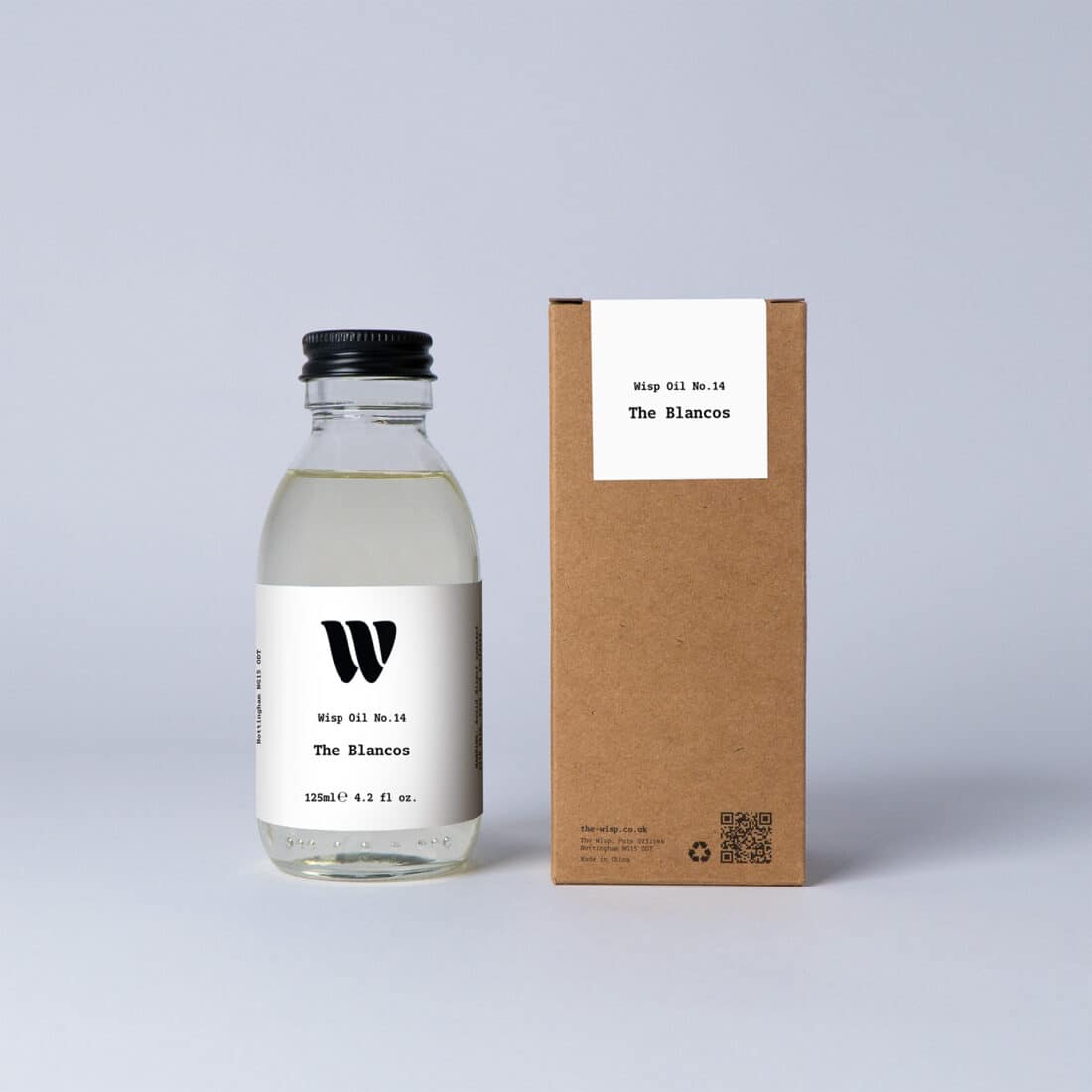 Bottle of the 125ml Wisp home fragrance oil No.14 The Blancos which has notes of soft violet and magnolia.