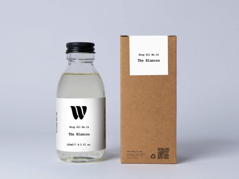 Bottle of the 125ml Wisp home fragrance oil No.14 The Blancos which has notes of soft violet and magnolia.