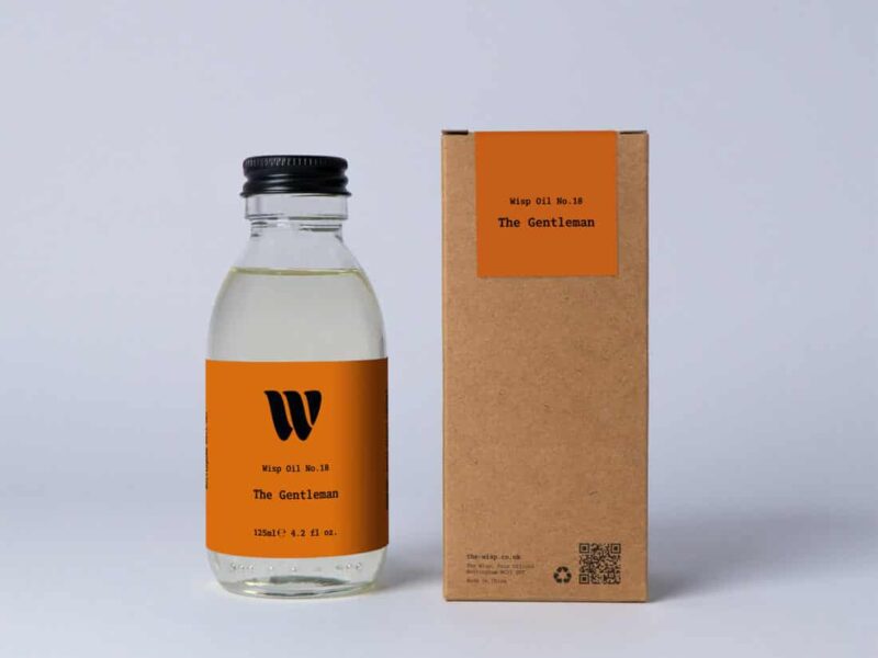 Bottle of the 125ml Wisp home fragrance oil No.18 The Gentleman which has notes of saffron, raspberry, and thyme.