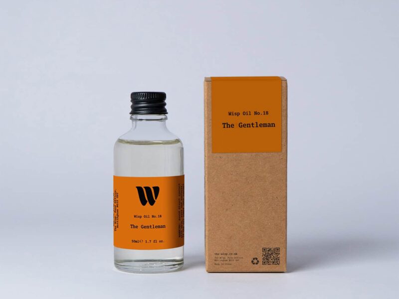 Bottle of the 50ml Wisp home fragrance oil No.18 The Gentleman which has notes of saffron, raspberry, and thyme.