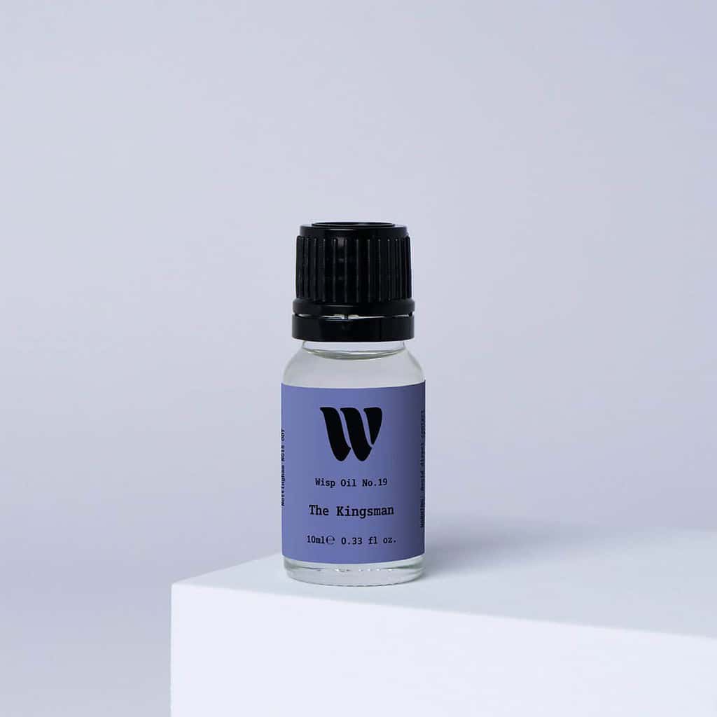 Bottle of the 10ml Wisp home fragrance oil No.19 The Kingsman which has notes of smoky sandalwood and vetiver.