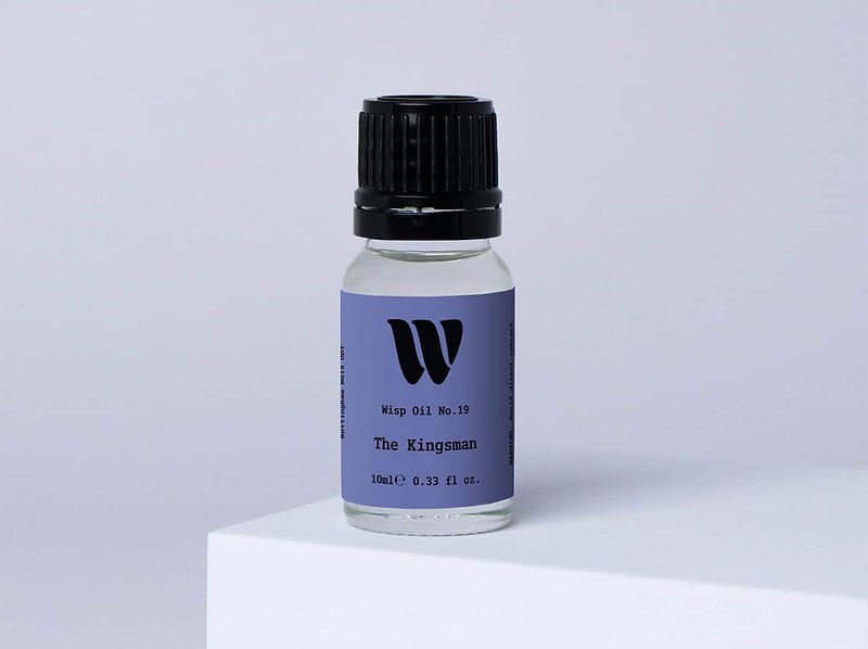 Bottle of the 10ml Wisp home fragrance oil No.19 The Kingsman which has notes of smoky sandalwood and vetiver.