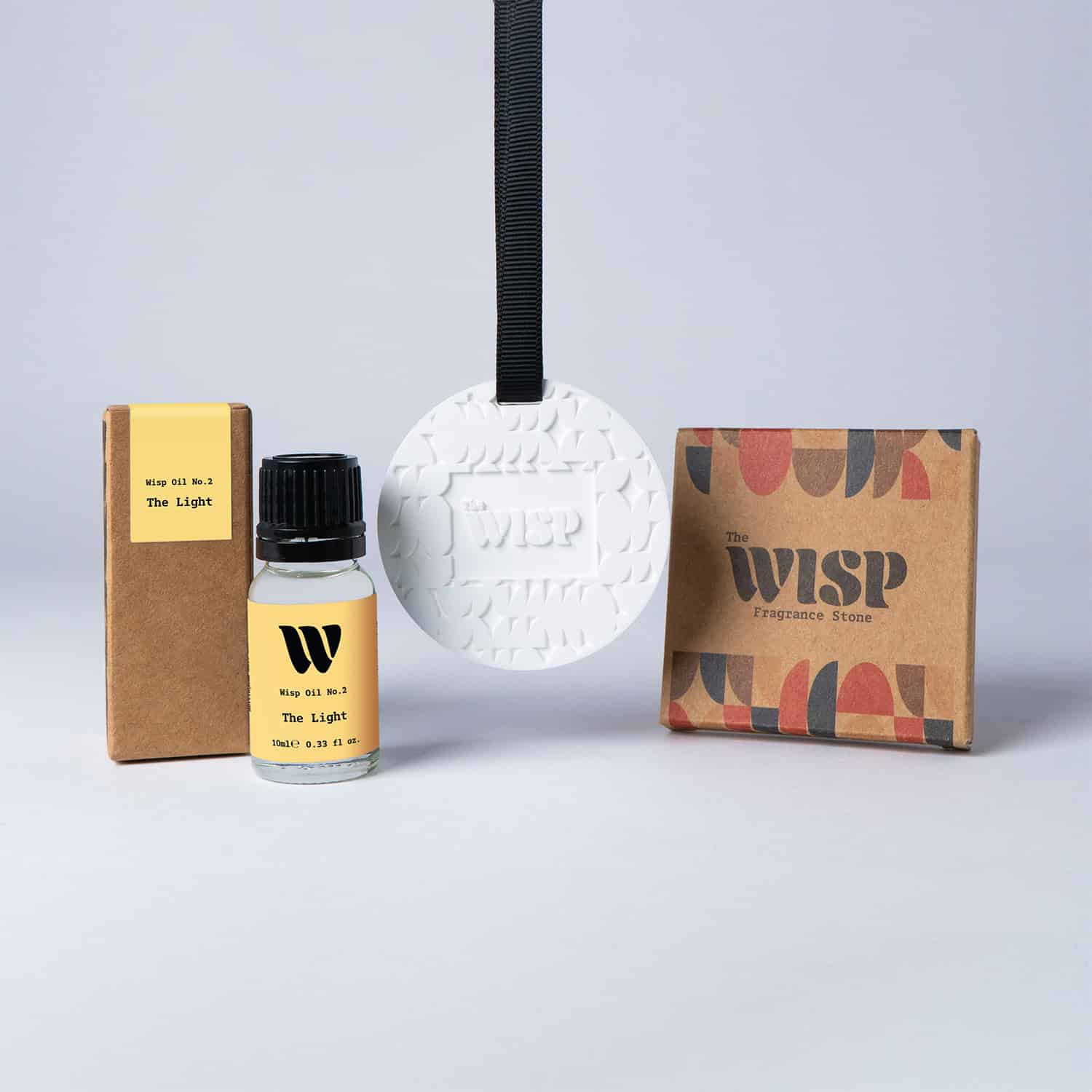 The Light Fragrance Stone gift set by The Wisp — ceramic scent stone, 10ml bright citrus home fragrance oil and kraft box