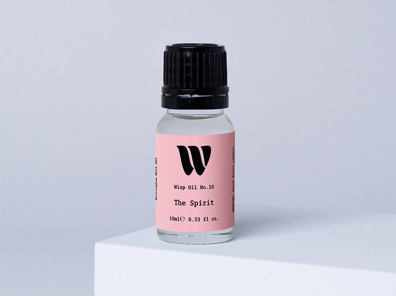 Bottle of the 10ml Wisp home fragrance oil No.20 The Spirit which has notes of ripe plum and crisp bergamot.
