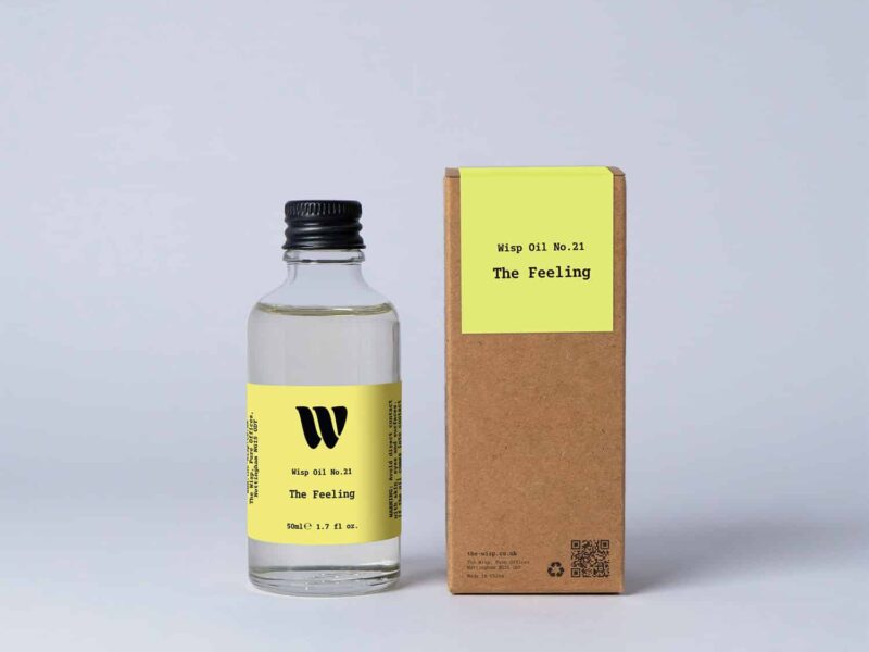 Bottle of the 50ml Wisp home fragrance oil No.21 The Feeling which has notes of blackcurrant berries and Bulgarian rose