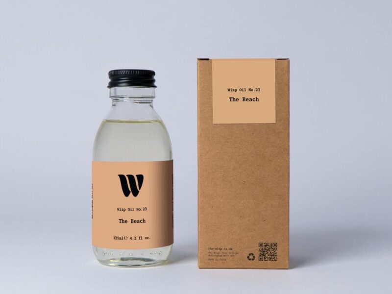Bottle of the 125ml Wisp home fragrance oil No.23 The Beach which has notes of subtle spices.
