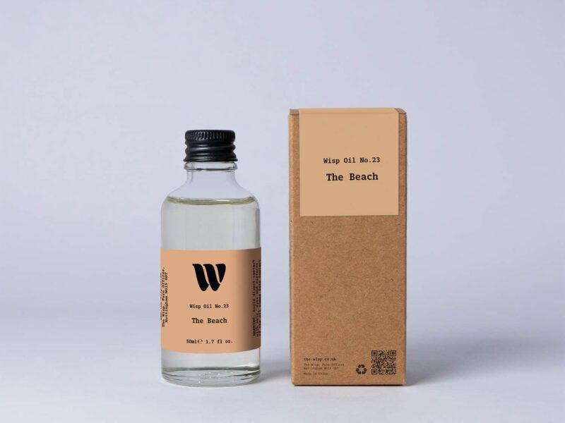 Bottle of the 50ml Wisp home fragrance oil No.23 The Beach which has notes of subtle spices.