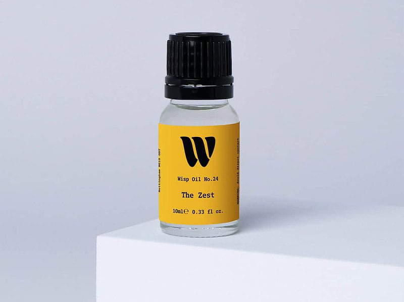 Bottle of the 10ml Wisp home fragrance oil No.24 The Zest which has notes of citrus, spiced ginger and cardamom