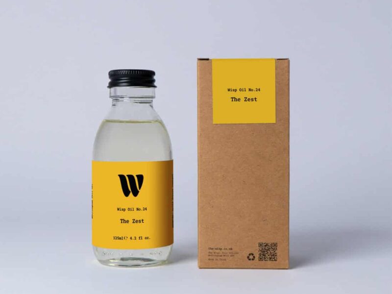 Bottle of the 125ml Wisp home fragrance oil No.24 The Zest which has notes of citrus, spiced ginger and cardamom.