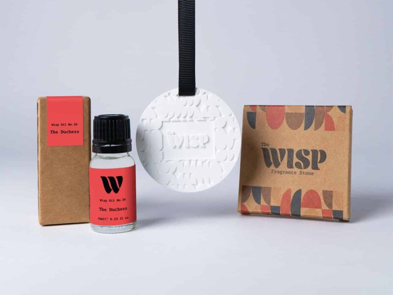 Bottle of the 10ml Wisp home fragrance oil No.26 The Duchess which has notes of hyacinth and musk, with a premium wisp branded fragrance stone to hang in car or wardrobe. The perfect small gift.