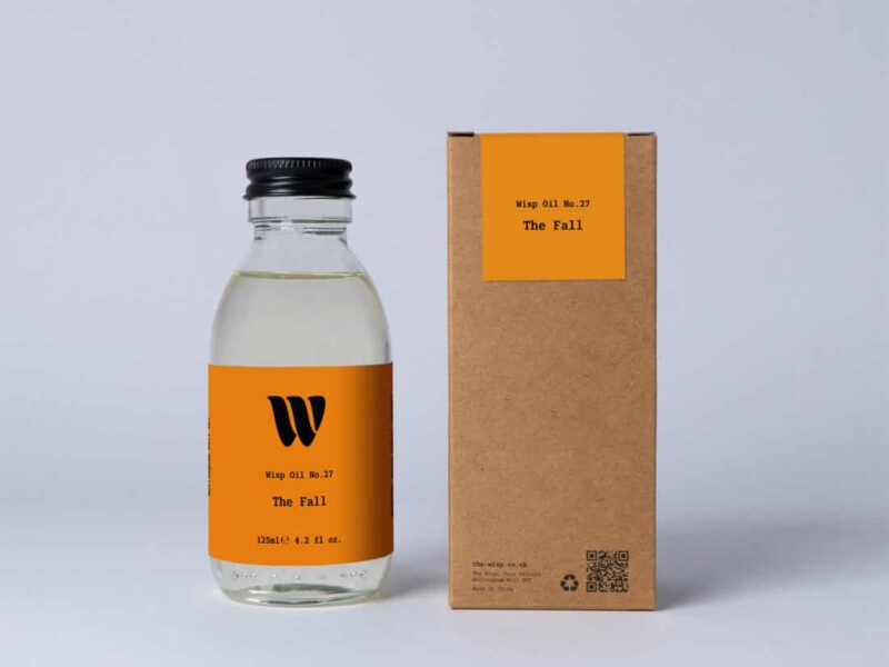 Bottle of the 125ml Wisp home fragrance oil No.27 The Fall which has notes of cedarwood, cardamom and pink pepper.