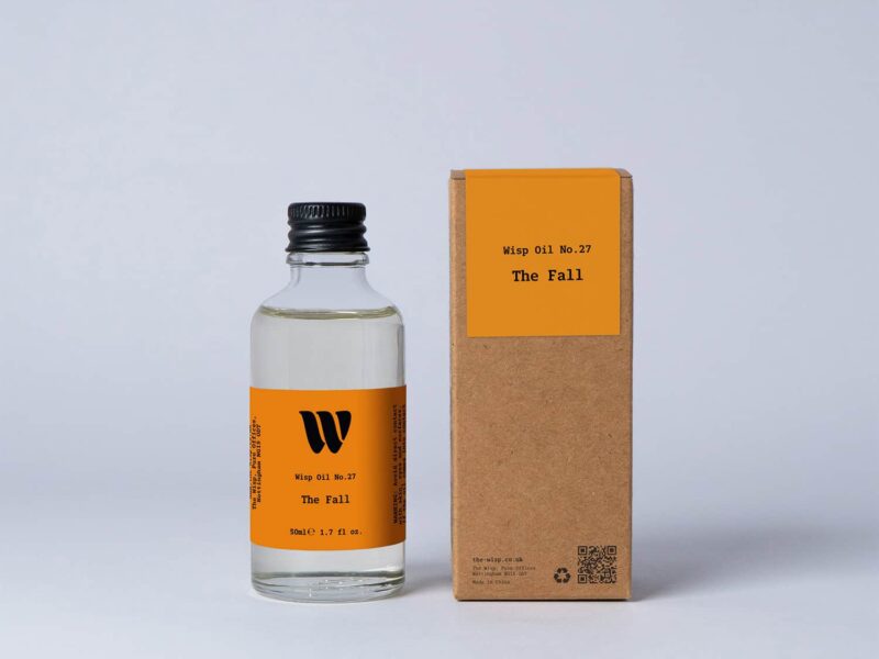 Bottle of the 50ml Wisp home fragrance oil No.27 The Fall which has notes of cedarwood, cardamom and pink pepper.