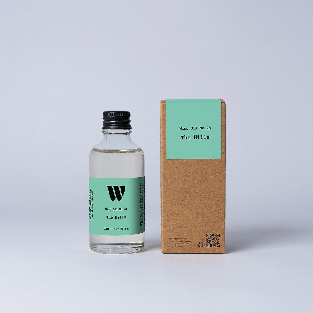 Bottle of the 50ml Wisp home fragrance oil No.28 The Hills which has notes of citrus, tea and cedarwood.