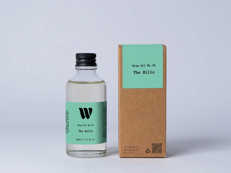 Bottle of the 50ml Wisp home fragrance oil No.28 The Hills which has notes of citrus, tea and cedarwood.