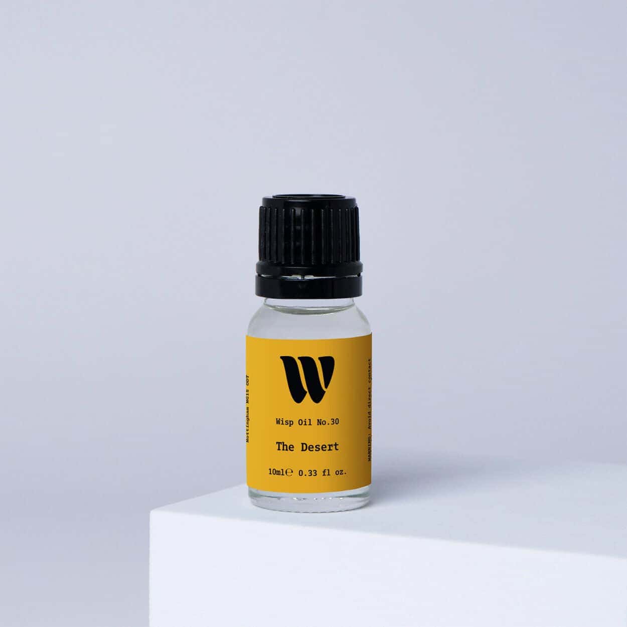 Bottle of the 10ml Wisp home fragrance oil No.30 The Desert which has notes of mandarin and Californian lemon.