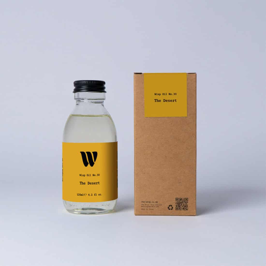 Bottle of the 125ml Wisp home fragrance oil No.30 The Desert which has notes of mandarin and Californian lemon.