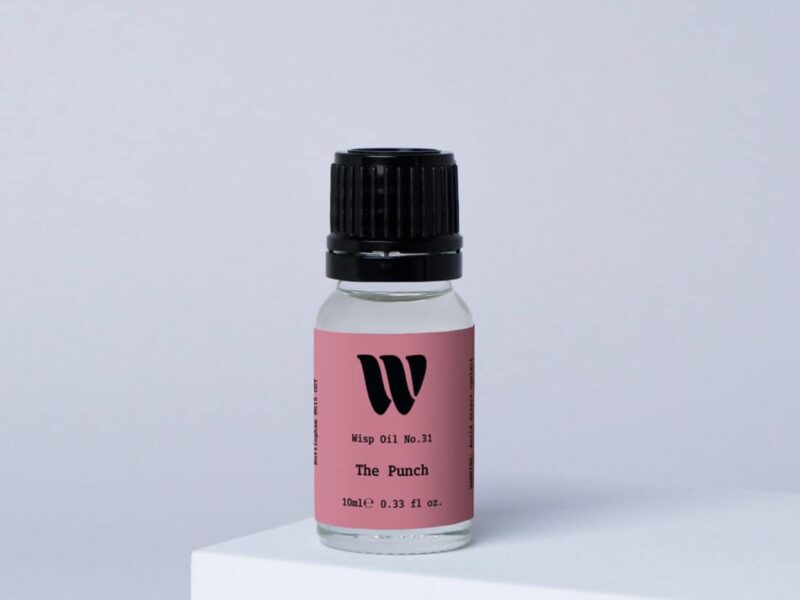 Bottle of the 10ml Wisp home fragrance oil No.31 The Punch which has notes of Mandarin and Orange Blossom