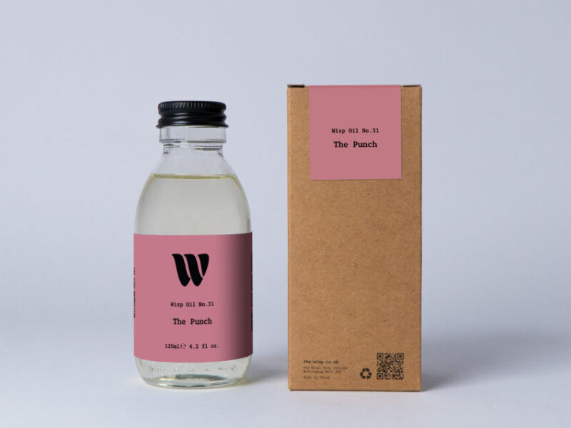 Bottle of the 125ml Wisp home fragrance oil No.31 The Punch which has notes of Mandarin and Orange Blossom