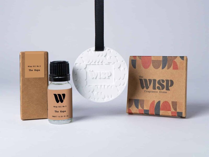 Bottle of the 10ml Wisp home fragrance oil No.5 The Kupa which has notes of leafy and zesty, with a premium wisp branded fragrance stone to hang in car or wardrobe. The perfect small gift.