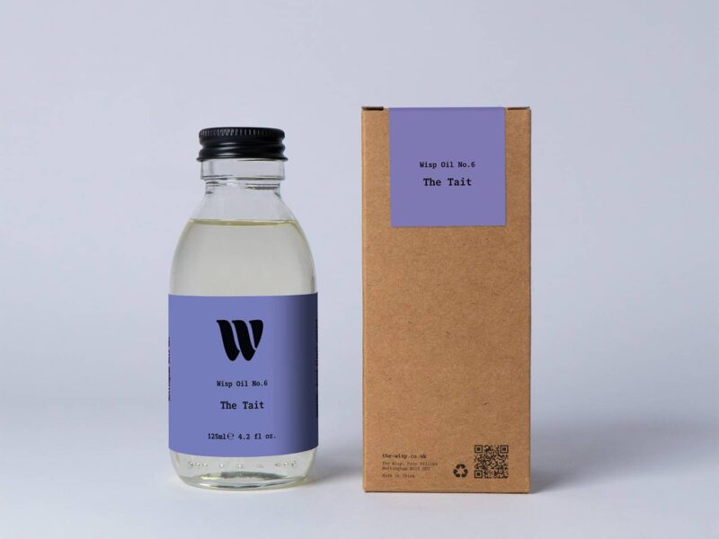 Bottle of the 125ml Wisp home fragrance oil No.6 The Tait which has notes of orange and grass.
