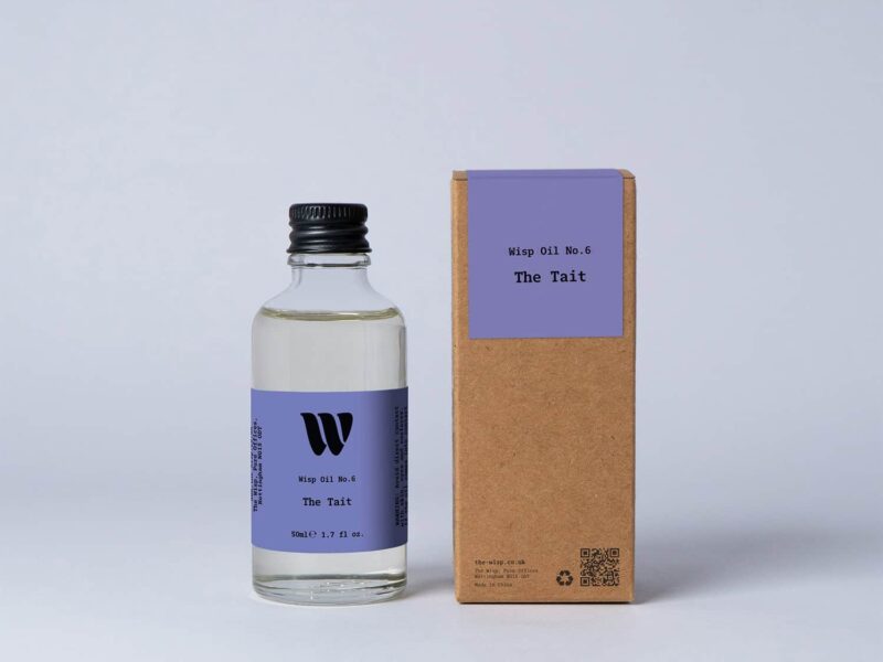 Bottle of the 50ml Wisp home fragrance oil No.6 The Tait which has notes of orange and grass.