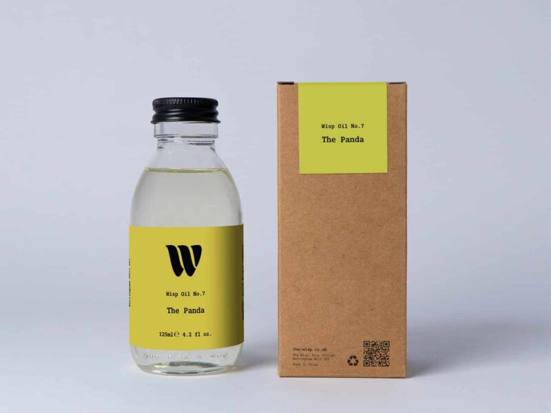 Bottle of the 125ml Wisp home fragrance oil No.7 The Panda which has notes of ylang-ylang, orange blossom, and bergamot