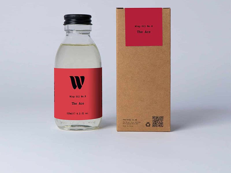 Bottle of the 125ml Wisp home fragrance oil No.8 The Ace which has notes of citrus, aromatic herbs, and florals