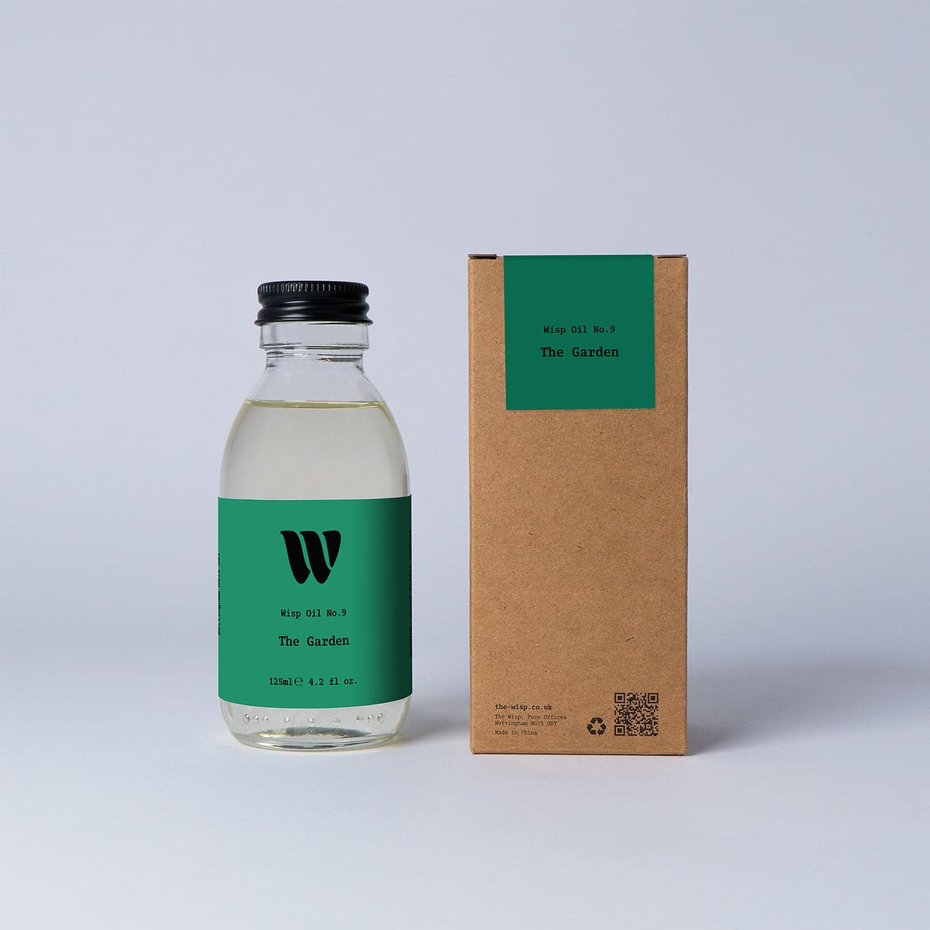 Bottle of the 125ml Wisp home fragrance oil No.9 The Garden which has notes of lotus blossom and water lily.