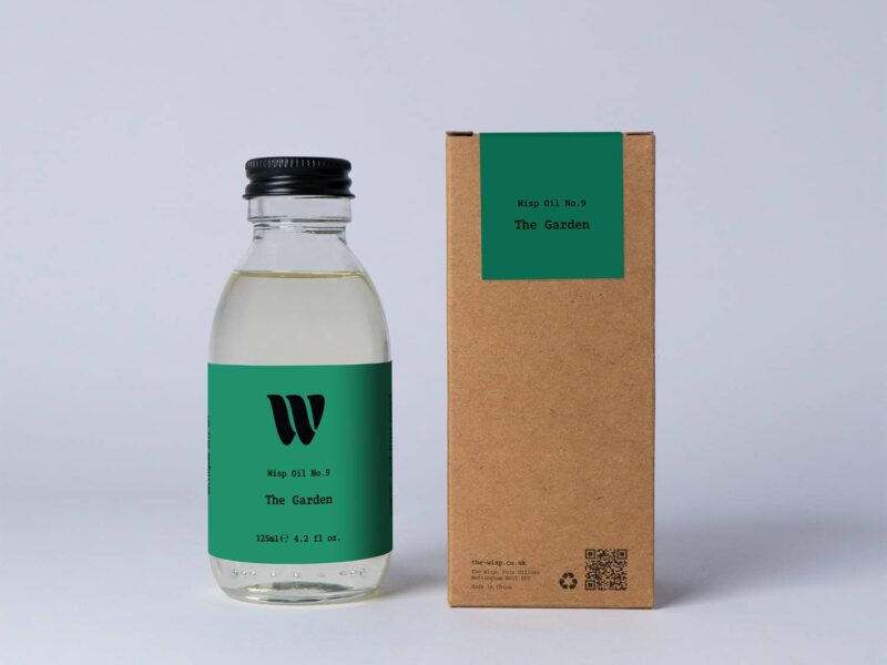 Bottle of the 125ml Wisp home fragrance oil No.9 The Garden which has notes of lotus blossom and water lily.